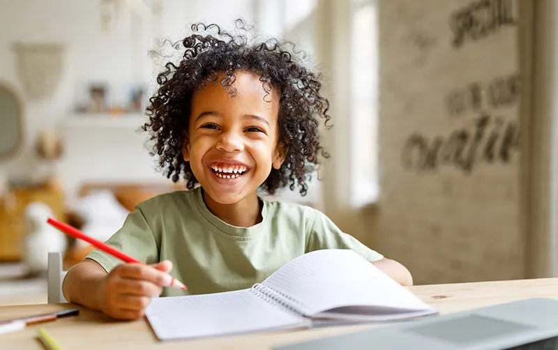 Boy smiling while at school