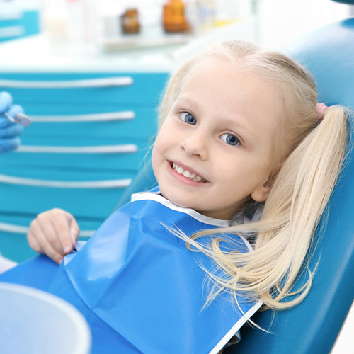 Girl smiling during pediatric dental visit
